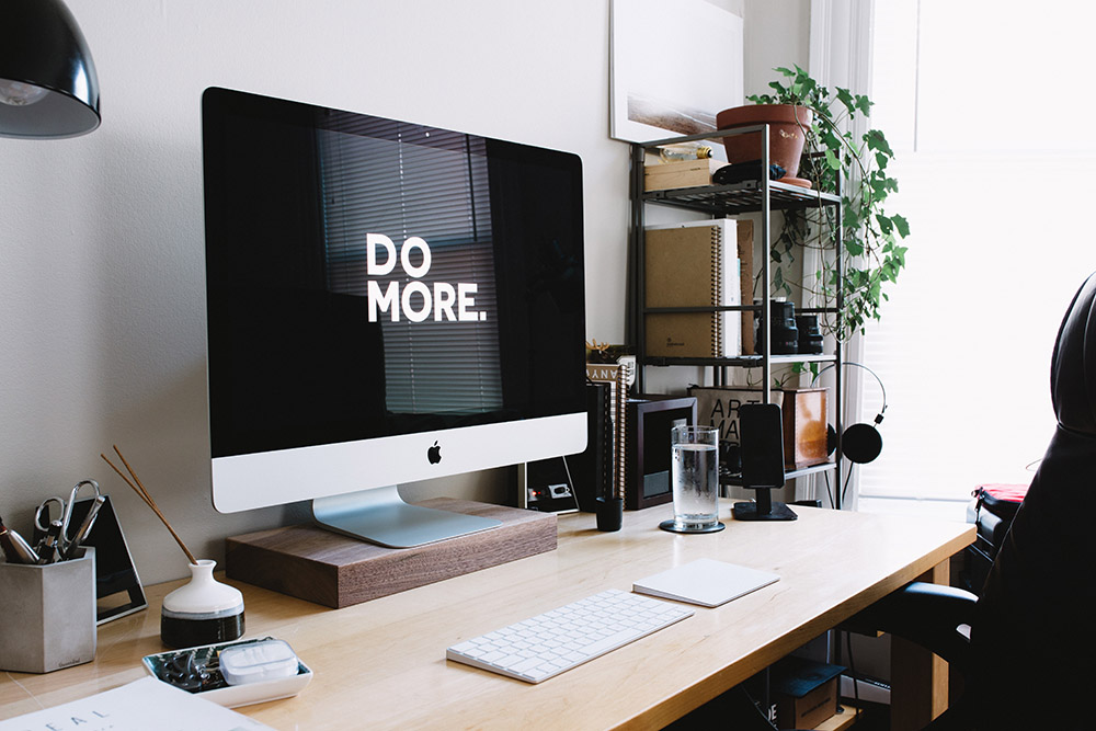Silver iMac on desk in study