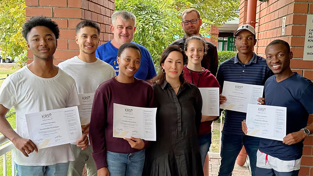 A photograph of a group of KRS interns holding their certificates of completion